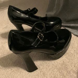 A show stopper. Black platforms with 5’inch heels brand new! By Ellie size 9.